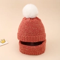 Detail of coral orange knit baby hat and scarf set with soft white faux fur pompom - Orange