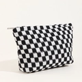 Knitted checkerboard cosmetic bag with black and white grid pattern and silver zipper - Black and White Plaid