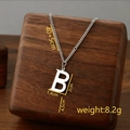 Silver titanium steel necklace with letter B pendant and tassel on wooden stand - Letter B / Silver