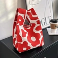 Red and cream knit tote bag with large floral patterns and comfortable top handle - Red Floral