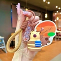 Cute 3D Capybara keychain charm with woven strap and acrylic tags for bags and keys - Wooden Bucket Model