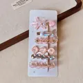 Detail of 6-piece hair clip set featuring resin starfish and pearls on a display card - Pink Starfish 5-piece Set