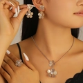 Golden 3-piece jewelry set featuring matte hollow flower necklace, earrings, and ring - Five-Petal Matte Flower Style (8389)