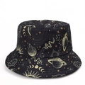 Detailed pattern of celestial bodies and snake print on black reversible bucket hat - M (56-58cm) / Black and Yellow Starry Sky