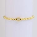 18k gold beaded bracelet featuring a cube charm with a diamond-studded letter W design - Letter W