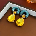Macro shot of vintage earrings with pear-shaped yellow crystal and turquoise accents - 27# Silver Pin-Blue-Champagne