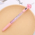 Pink cat paw gel pen with quicksand glitter and 100%少女 text on barrel - LED Bear Paw Fairy Pen Light Pink