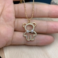 Detail of a golden bear pendant with sparkling zircons and elegant white pearls - Hollow Double Pearl Style (H)