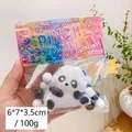 Panda-shaped soft squeeze toy in packaging measuring six by seven by three centimeters - Plush Panda