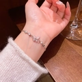 Elegant silver butterfly star bracelet with pink gradient charms on model wrist - S663 Silver