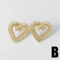 Elegantes pendientes de corazón bañados en oro con circonitas brillantes y cristales - Pendientes colgantes de doble corazón con micro pavé de circonita