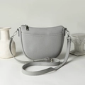Light grey crescent shoulder bag in pebble leather with adjustable strap and zip closure - Gray