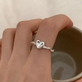 Silver S925 sterling silver heart ring with twisted rope band shown on a finger - 3D Heart Twisted Rope Style (J3337)