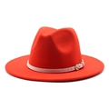 Detail of red wool fedora hat featuring a stylish cream leather band and gold metal buckle - Orange Red