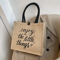 Beige linen tote bag with black handles and enjoy the little things printed text - Enjoy