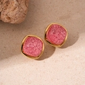 Macro shot of square pink textured resin earrings with elegant golden metal borders - Rounded Square Crackle Resin Studs / Pink