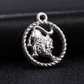 Macro view of silver Leo zodiac charm with rope border on black leather background - Style 10 / Antique Silver