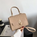 Beige crocodile embossed crossbody bag with golden horseshoe buckle and top handle - Khaki