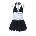 Detail of polka dot halter dress featuring elastic pleated waist and puff bubble hemline - S / Black
