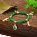 Vintage green beaded bracelet with religious Saint charms and gold metal accents - Green (4120)
