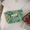 Detail of green floral jacquard fabric mini pouch with simple wish label and zipper - Golden Silk Green Jacquard