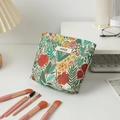 Detail of floral embroidery fabric and brand label on large capacity makeup bag - Small / Green Floral