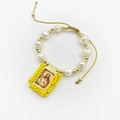 Detail view of handmade natural pearl bracelet with Sacred Heart of Jesus icon - Yellow