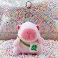 Pink plush capybara keychain with white bag featuring green Fa embroidery - Pink Green Fortune + Silver Clip