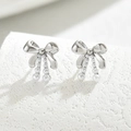 Silver bow stud earrings with dangling white pearl accents on elegant stone background - Silver Pearl Pendant Style (EH4586-3)