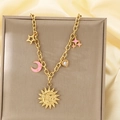 Close-up of 18K gold plated chain with celestial sun, pink moon, and star pendants - Star Moon Heart Style (KN292153-SXSJ)