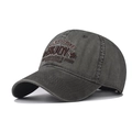 Detailed close-up of premium 3D embroidery on washed cotton vintage baseball cap - Army Green