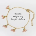 Detail of gold cherry charm bracelet with pink crystals, length 18+5cm and 4g weight - Gold Cherry Bracelet