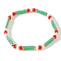 Bohemian Tila bead bracelet featuring green, red, and white beads with gold accents - Green Red Gold White