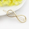 Polished gold infinity symbol hair clip with a sleek geometric metal finish for women - Gold Infinity
