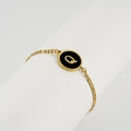 18K gold plated stainless steel bracelet featuring a round black enamel letter Q charm - Letter Q / Gold/Black