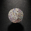 Silver geometric round ring featuring multi-colored rhinestone pavé on a dark background - Silver