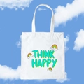 White canvas tote bag with green Think Happy text and rainbow clouds on blue sky background - Think Happy / Rainbow Clouds