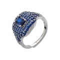 Macro shot of silver hip-hop ring with square blue gemstone and pave micro-diamonds - Platinum Blue Zirconia