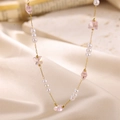 Elegant gold necklace featuring pink crystal butterfly and white imitation pearl charms - Pink Butterfly & Pearl