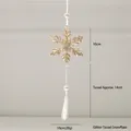 Glittery gold snowflake Christmas ornament with white faux pearls and a long hanging tassel - Tassel Snowflake