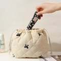 Quilted drawstring cosmetic bag portable travel makeup storage pouch beige minimalist style - White / Black Bow