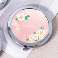 Detail of round silver compact mirror with pink daisy wreath and Mother's Day message - Daisy Pink Mother's Day