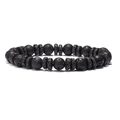 Detail of natural volcanic rock beads with tiger eye stones on a minimalist woven bracelet - Elastic Cord Style / Black