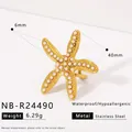 Macro shot of 40mm golden starfish jewelry with white pearls and stainless steel texture - Sea Star Style (NB-R24490)
