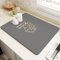 Detail of grey absorbent kitchen mat featuring Smile text and cheese pattern on counter - Smile Cheese