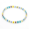 Handmade Tila bead bracelet featuring vibrant colorful glass tiles and a gold accent bead - Dopamine Rainbow Style
