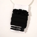 Detail view of black foam heatless hair curler set with two clips on display card - Set (With Card) - Black