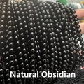 Close-up of polished natural obsidian round beads for DIY jewelry making and beading - Natural Black Obsidian 4mm (Approx. 90pcs) Strand