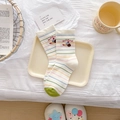 White crew socks featuring colorful stripes and dachshund dog embroidery detail - Striped Dog Head