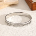 Bracelet en acier titane argenté avec motif grec et double rangée de strass - Couleur Acier